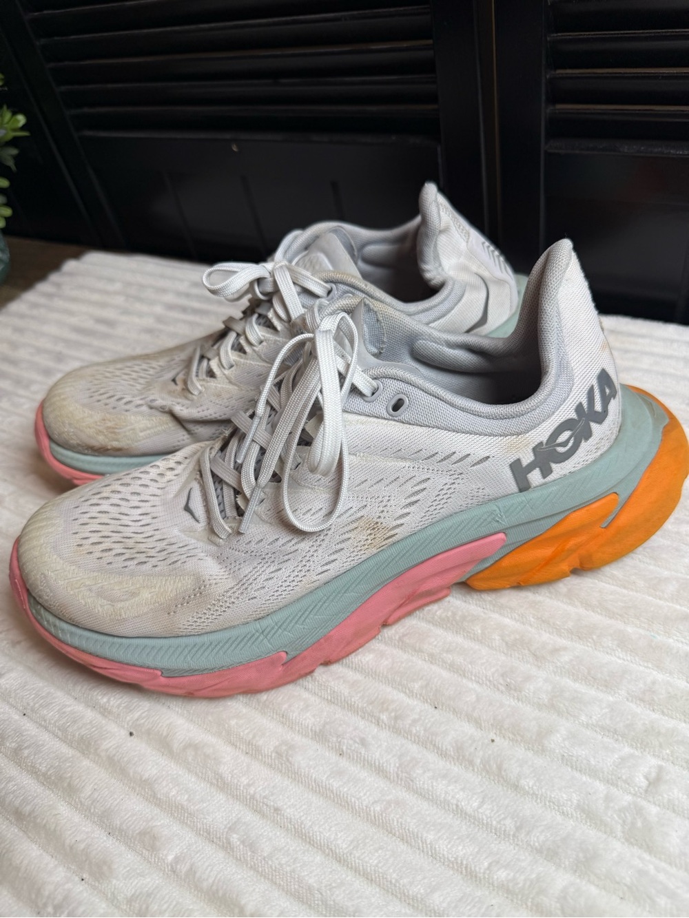 Hoka Women's Light Gray Running Shoes with Pink & Orange Accents